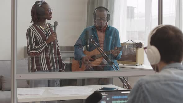 African Musical Band Recording Song in Studio