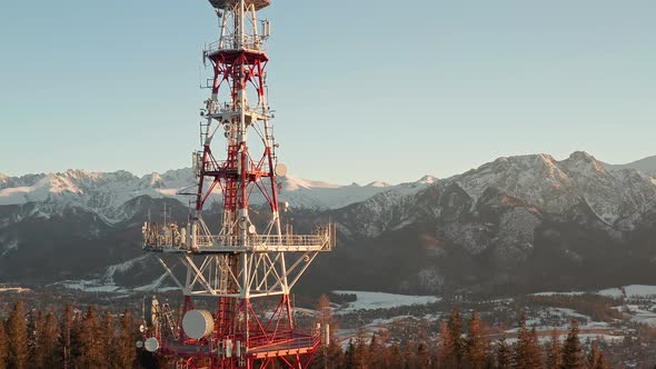 Zakopane-Gubalowka Transmitter Tower With Snowy Mountain  In Background At Zakopane, Poland. - aeria