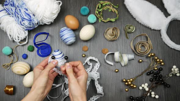 Top View Process of Making Easter Egg. Woman Pick Decor for Stylish Eggs