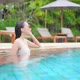 Young asian woman enjoy around outdoor swimming pool for leisure - VideoHive Item for Sale