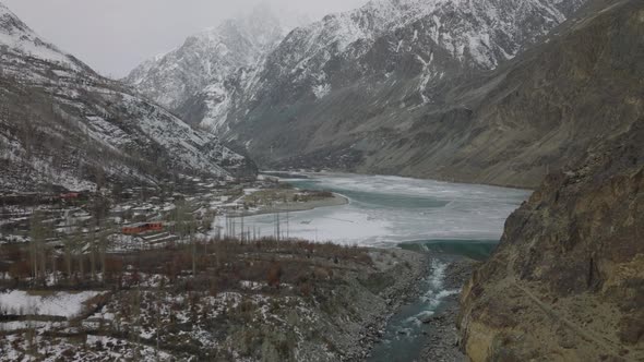Cinematic Aerial View Of Frozen Khalti Lake In Gupis-Yasin Valley. Dolly Forward, Zoom In