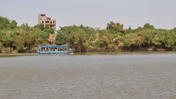 A boat on the Nile River near Khartoum in Sudan - follow shot