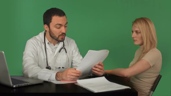 Doctor and Patient Discussing - Visit in the Office on a Green Screen, Chroma Key