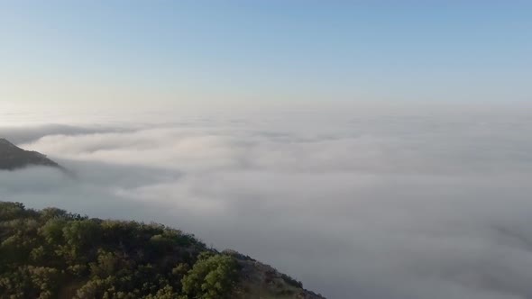 Cliff of the canyon into endless clouds and a horizon in Malibu Canyon, Monte Nido, California, USA