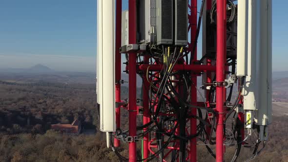 Tilting on telecommunication tower equipment aerial 4K footage