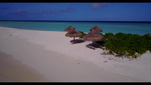 Aerial panorama of tropical coast beach voyage by blue ocean with white sandy background of a picnic