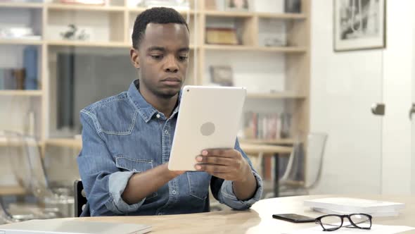 AfroAmerican Man Using Tablet