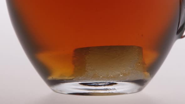 Time Lapse. Sugar Is Dissolved in the Cup of Tea