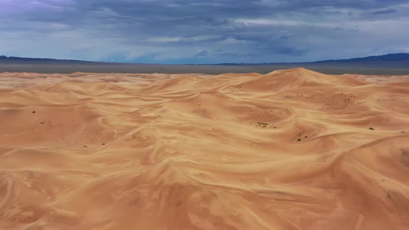 Aerial View on Sand Dunes with Storm Clouds