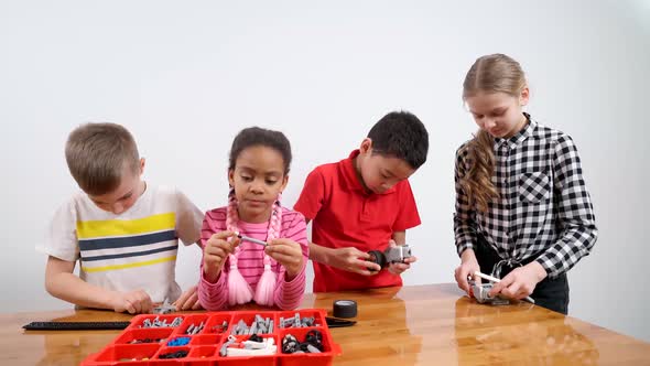 Young Friends Using Building Kit