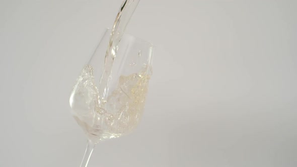 Super Slow Motion of Pouring White Wine in Tilted Glass Shot at 1000 Fps