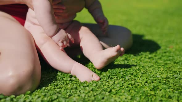 A Kid Having Loads of Fun Jumping in Grass