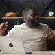 Happy African Businessman Dancing Cheerfully While Working at Laptop in Home Office - VideoHive Item for Sale