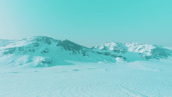 Snowed Mountains in Alaska with Fog