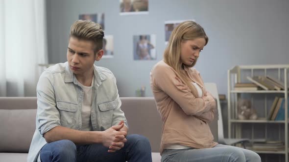 Upset Girl Looking Hurt at Guy Waiting Apology, Difficulties in Relationship