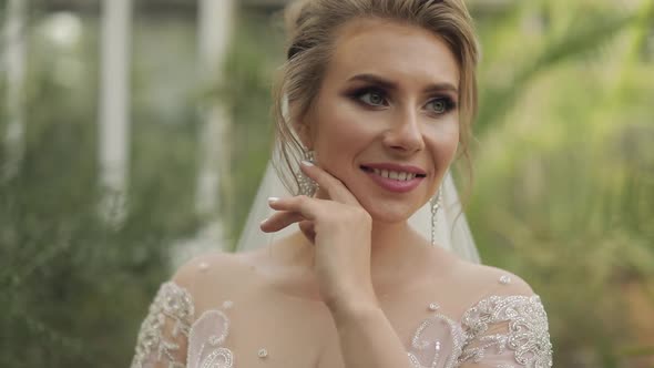 Beautiful and Lovely Bride in Wedding Dress in the Park. Slow Motion