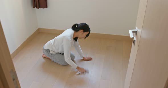 Woman clean the floor at home