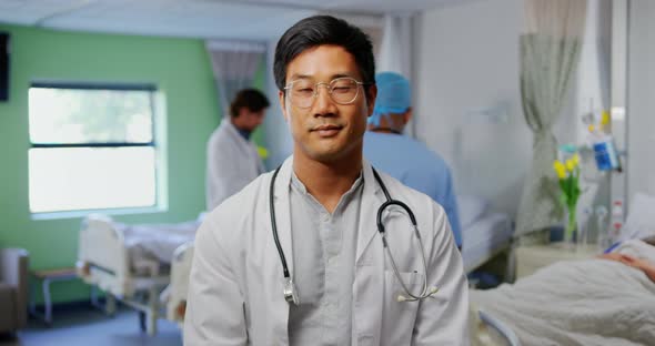 Male doctor standing in the ward at hospital 4k