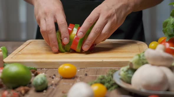 Professional Chef Prepares Red and Green Bell Pepper