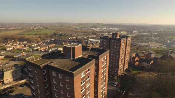 Aerial footage view of high rise tower blocks, flats built in the city of Stoke on Trent to accommod