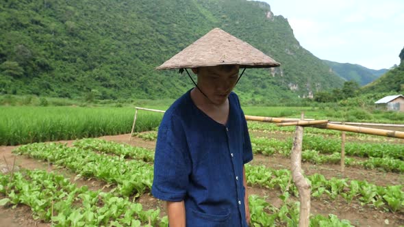 Farmer Walking Through His Field