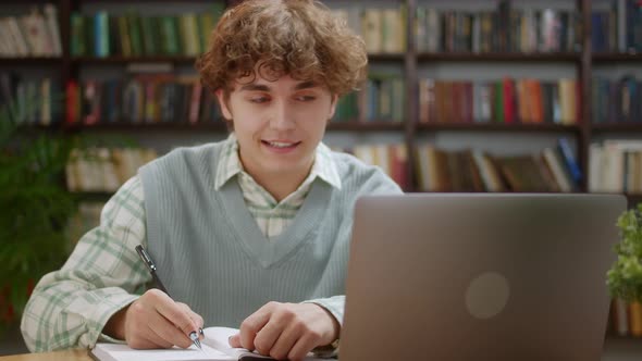 Man College Student Using Laptop Computer Watching Distance Online Learning Seminar Class Remote