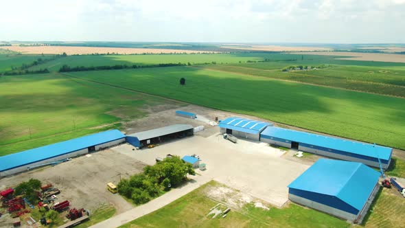 Warehouses Surrounded By the Fields Nature and Agriculture Film Grain