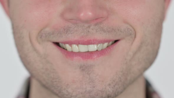 Close Up of Smiling Lips of Young Man