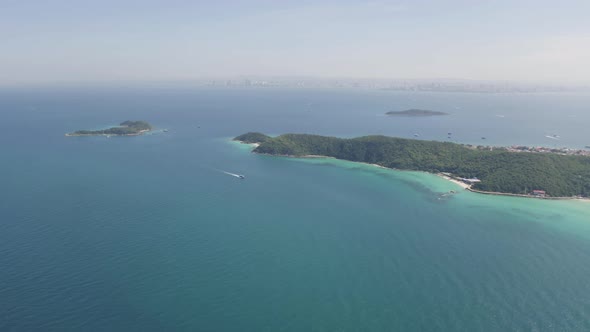 Aerial view of Koh Larn beach, Pattaya with blue turquoise seawater, mountain hills