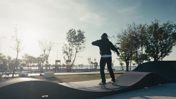 Skateboarder on a Pump Track Park