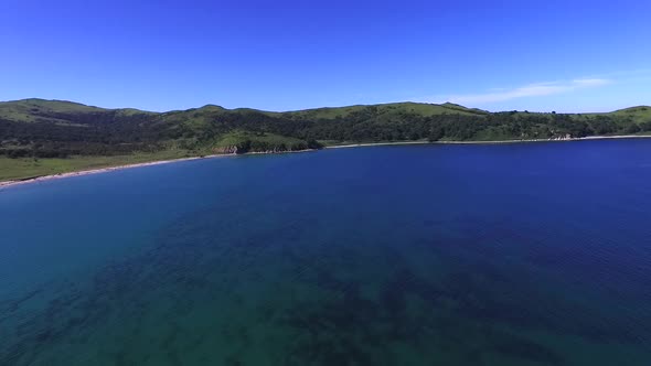 Flying Over the Blue Sea Surface in the Azure Lagoon