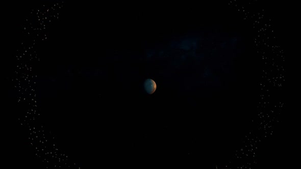 A Mysterious Planet Slowly Revolves In A Large Ring Of Meteorites. Dark Space. Long Shot