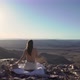 Young Woman Sitting Topless on Blanket at Edge of Fish River Canyon in Namibia - VideoHive Item for Sale