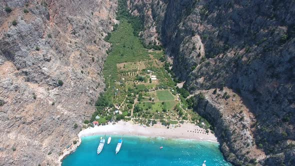 Deep Rocky Narrow Valley by the Turquoise Sea