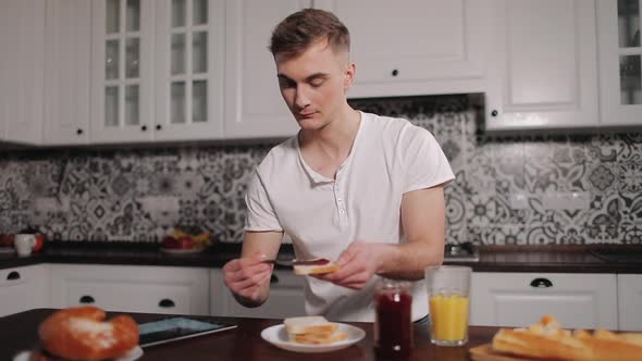 Man Using Tablet During Breakfast