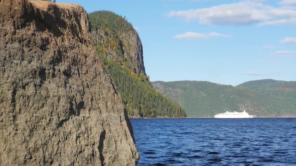 Revealing Large Body Of Water With A Cruiseship In The Background And Surrounding Mountains