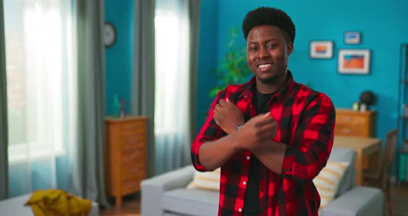 Portrait of the Successful Young African Teenage Boy Crossing His Arms and Smiling