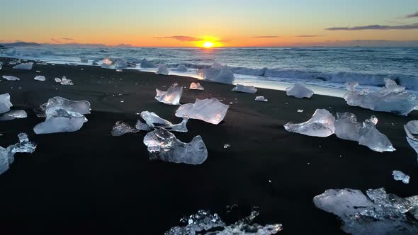 Ice From a Glacier Washing By Atlantic Ocean Waves on a Black Diamond Beach in Iceland. Global