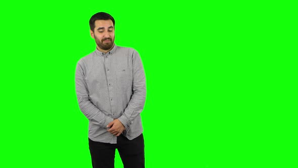 Brunette Guy Is Daydreaming and Smiling Looking Up. Green Screen