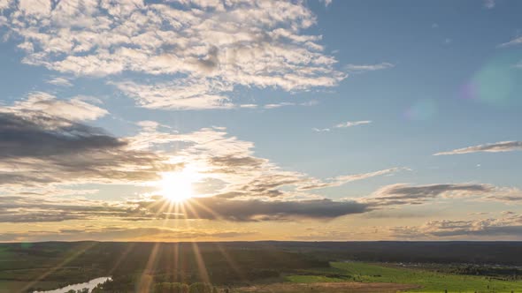 Beautiful View of the Wild Field During Sunset, Time Lapse, Clouds of Different Levels Move To the