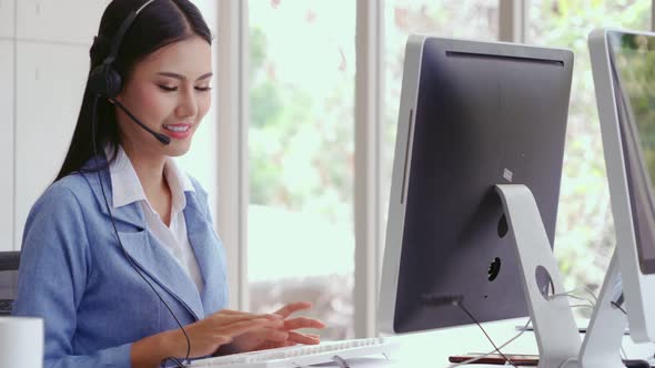 Customer Support Agent or Call Center with Headset Talking to Customer on Phone