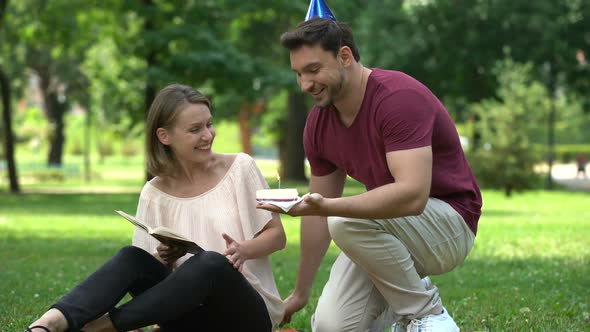 Caring Man Congratulating Girlfriend on Birthday or Anniversary of Relations