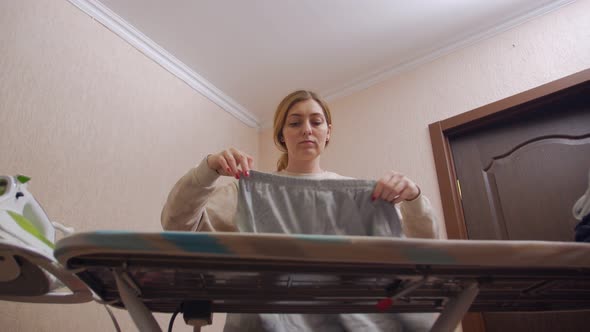 Young Woman Ironing