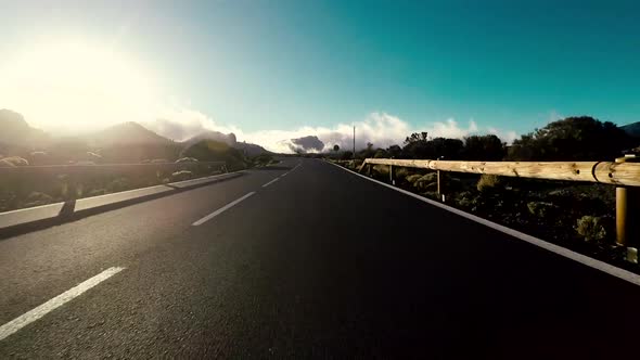 Long asphalt road ground view and travel concept - mountain and sky landscape