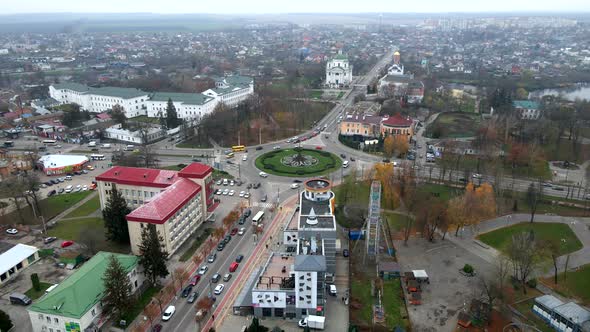  Aerial View of Roundabout Road with Circular Cars in Small European City at Cloudy Autumn Day