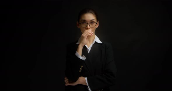 Business Woman Vaping on an Isolated Black Background