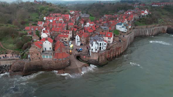 Scenic Robin's hood bay landmark village rooftops aerial view across coastline