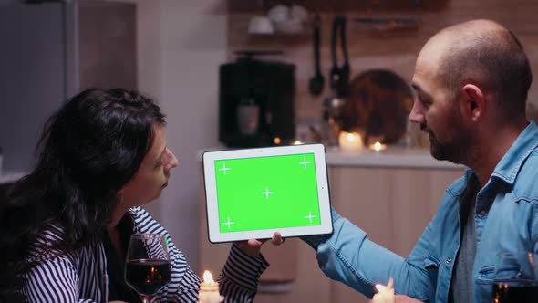 Couple with Green Screen Tablet