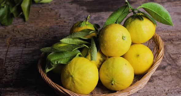 Basket of a yellow lemons on the table 