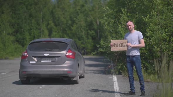 Man Catches a Passing Car